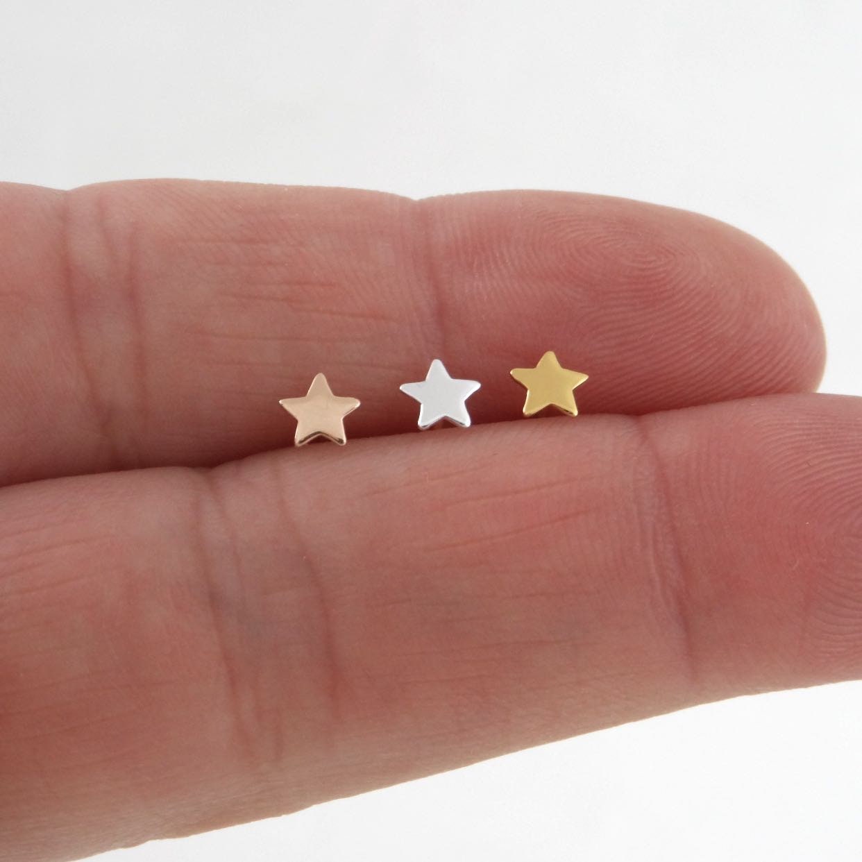 SINGLE-Tiny Star Earring in Sterling Silver